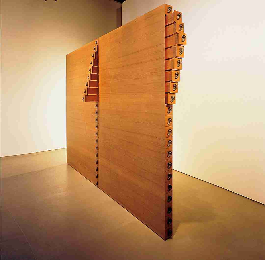 Two Senses, Tresserra Collection. Furniture made from drawers whose bronze handles are a nose and an ear.
